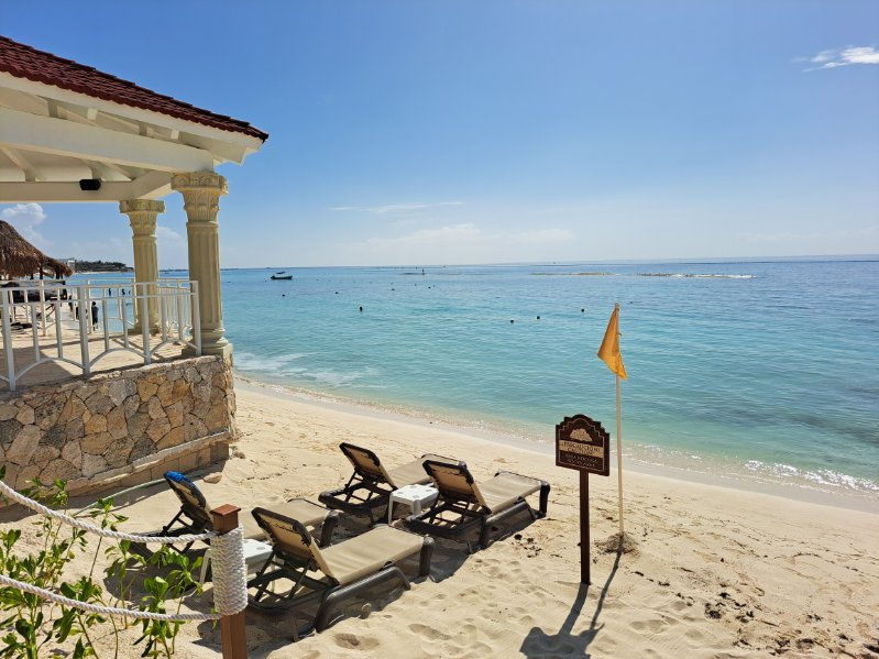 Beachfront resort with lounge chairs and ocean views for a relaxing retirement vacation