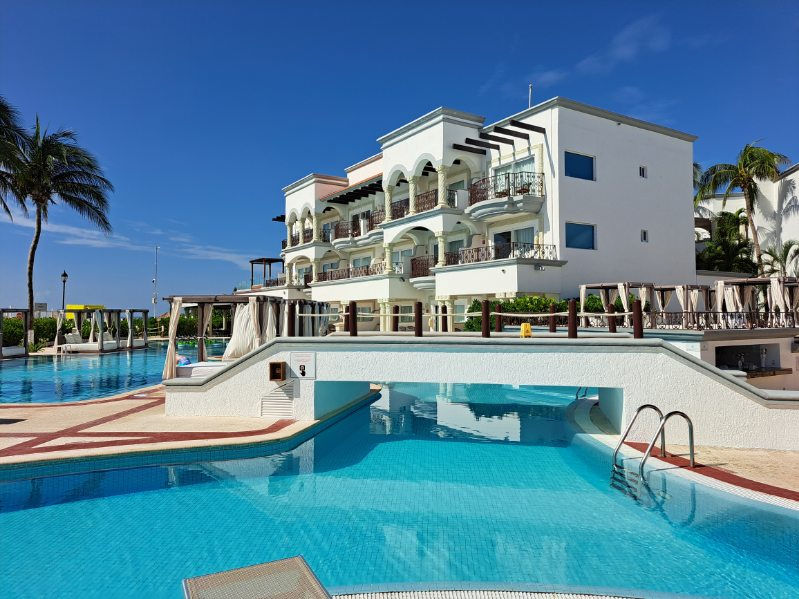 Luxury tropical beach resort with swimming pools and upscale accommodations for retirees and senior travelers