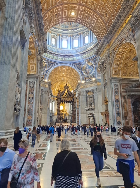 Visitors exploring St. Peter's Basilica on an escorted vacation in Europe