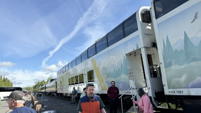 Senior travelers boarding a scenic train during an escorted vacation tour